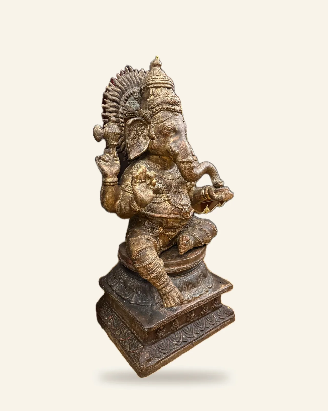 Seated Ganesha with flaming aureole, three-quarter view