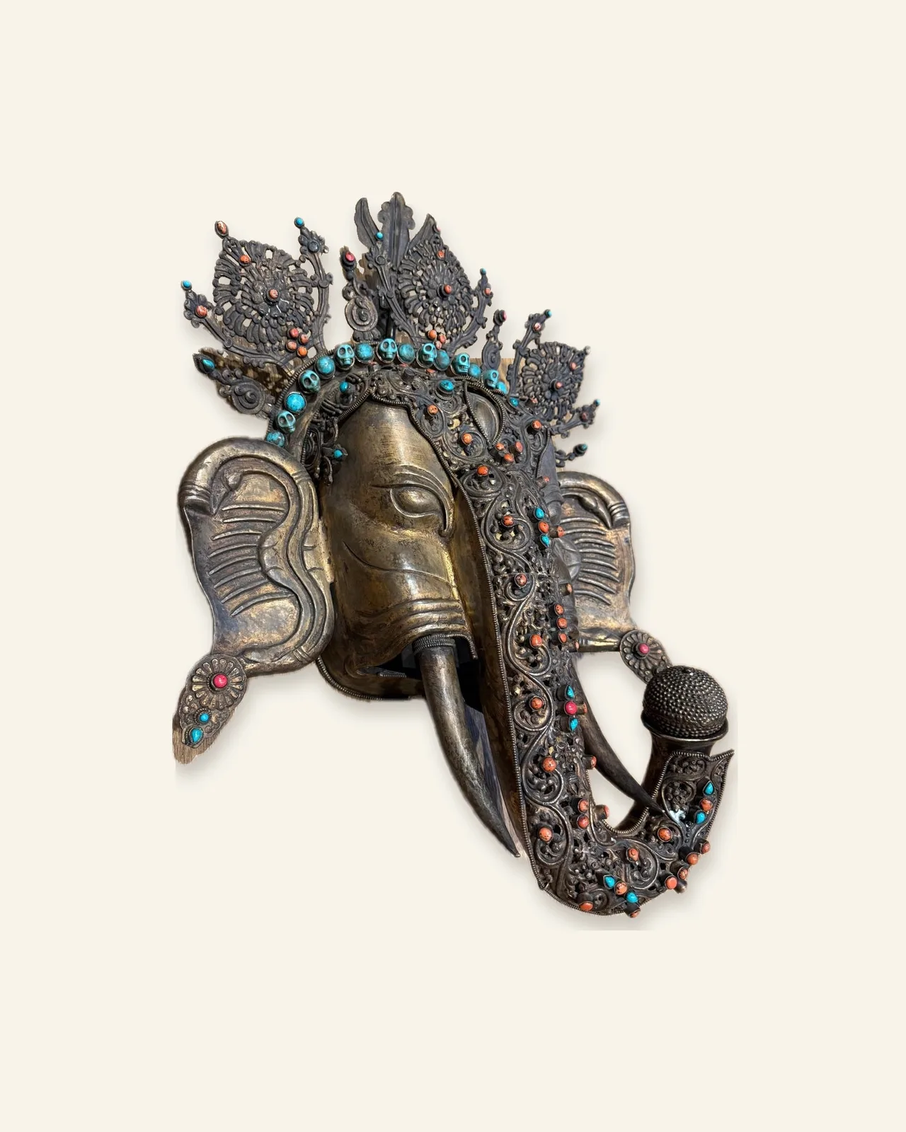 Gilt copper mask of Ganesha, side view