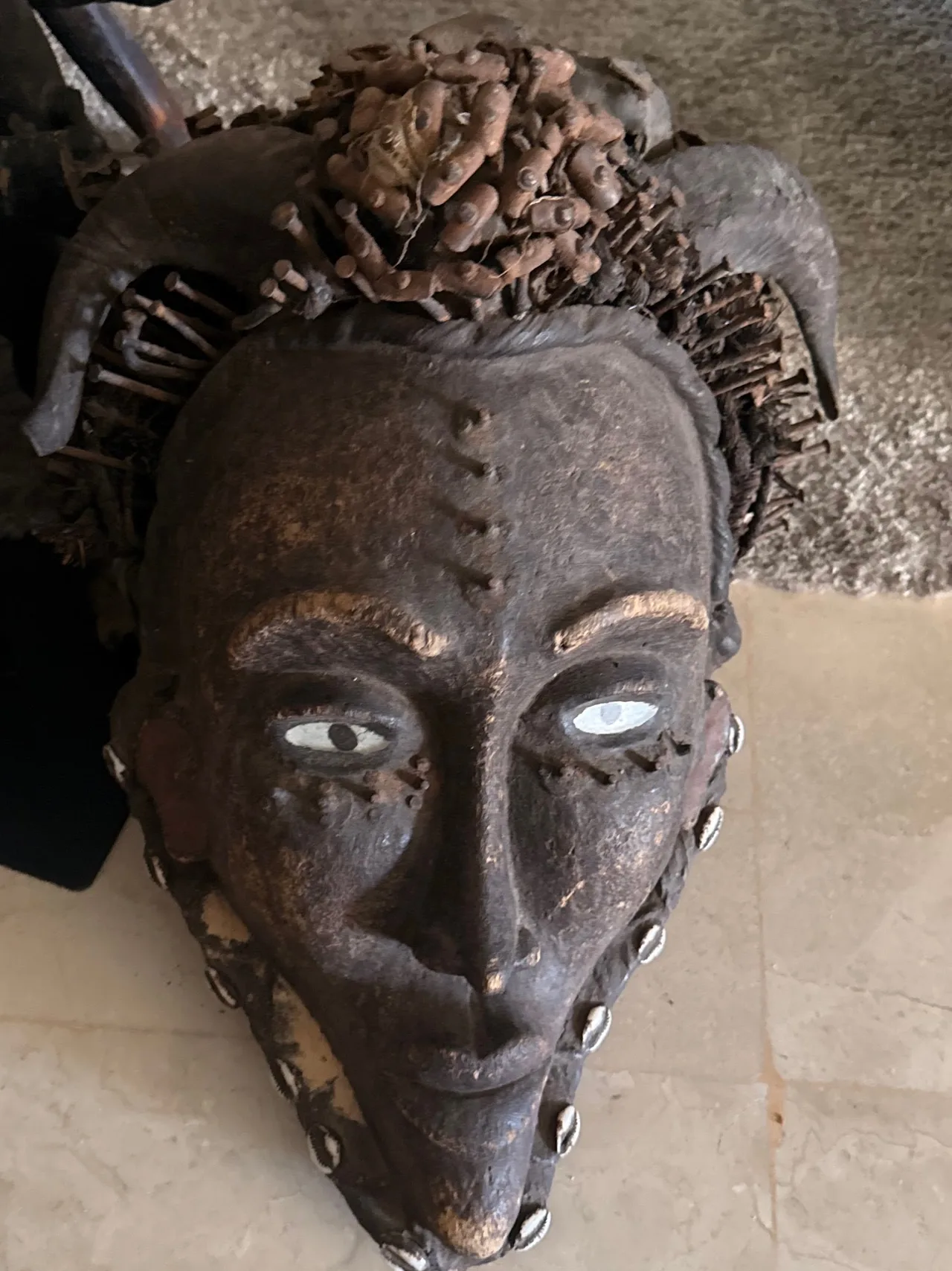 Carved Wooden Encrusted Power Mask with Nails and Cowrie Shells