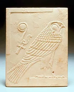 Egyptian Double-Sided Limestone Plaque Depicting a Falcon and a Head