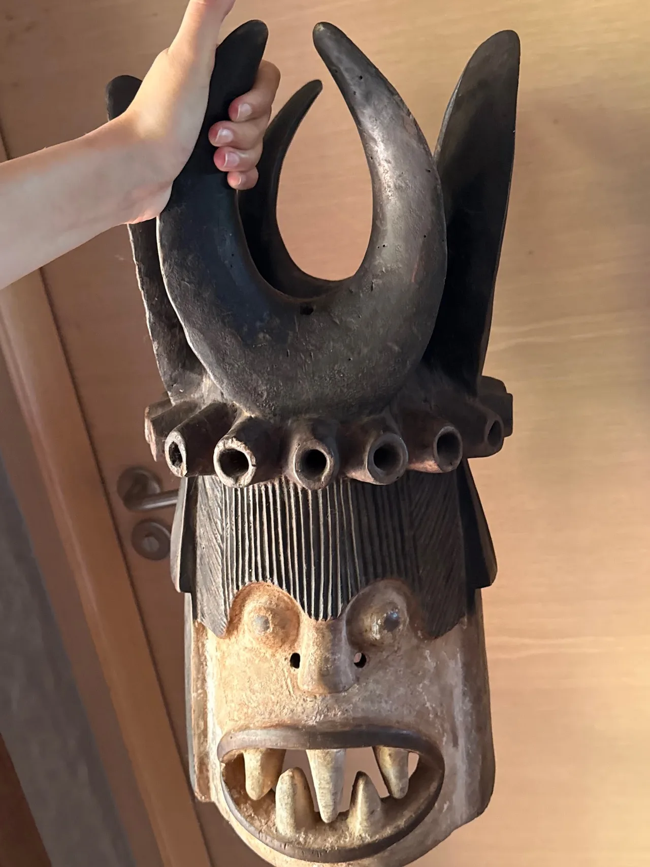 Carved Wooden Horned and Studded Mask with Bared Teeth