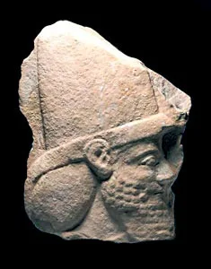Assyrian Limestone Wall Panel Depicting the Head of a Man
